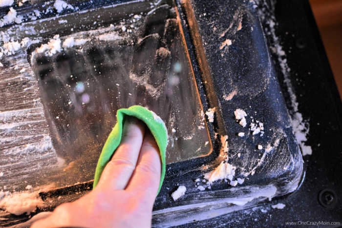 Wiping off paste with a cloth. 