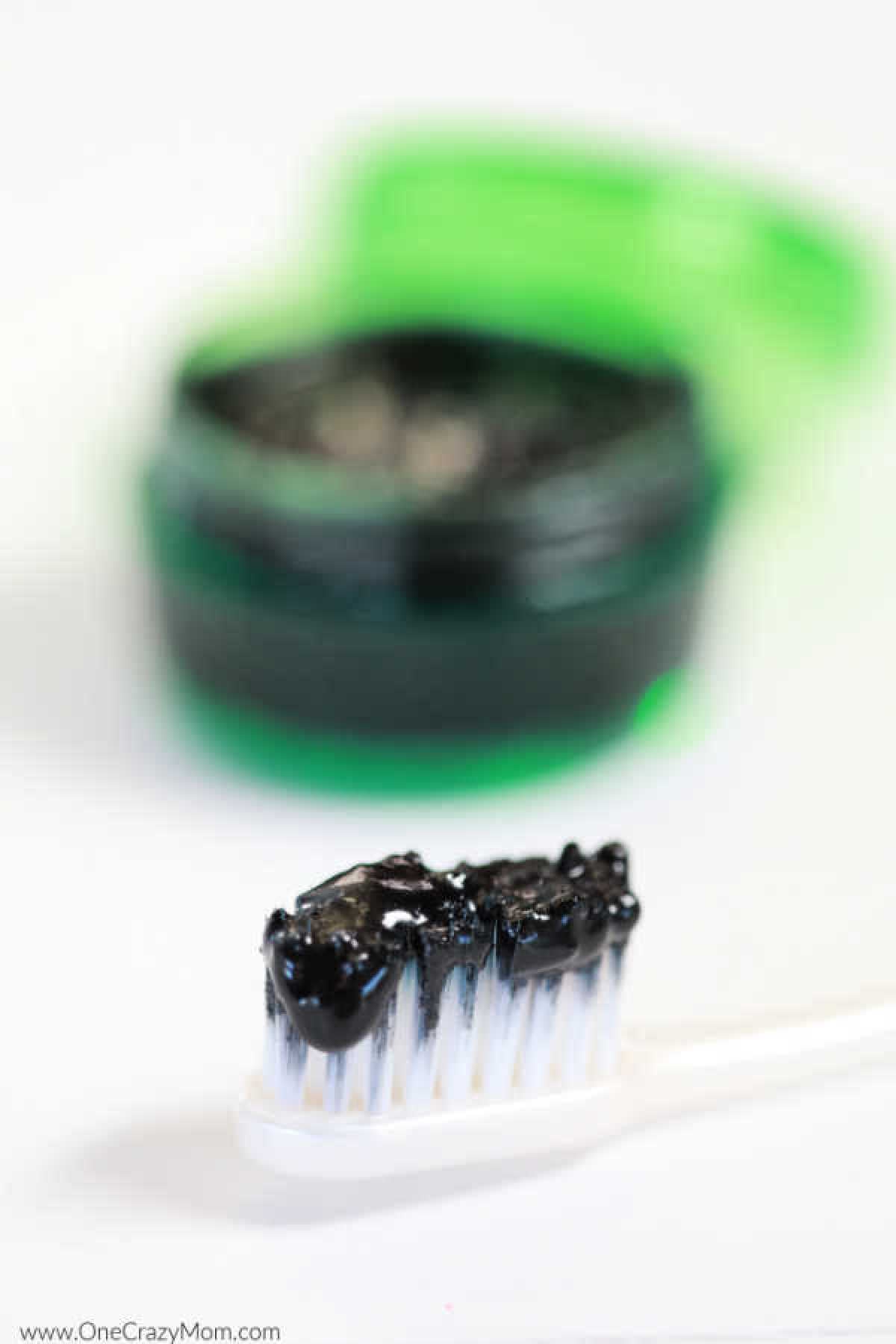 Activated Charcoal Teeth Whitening works great while being all natural. Homemade charcoal teeth whitener is easy to make and you will have a brighter smile. Toothbrush with charcoal whitening mixture.