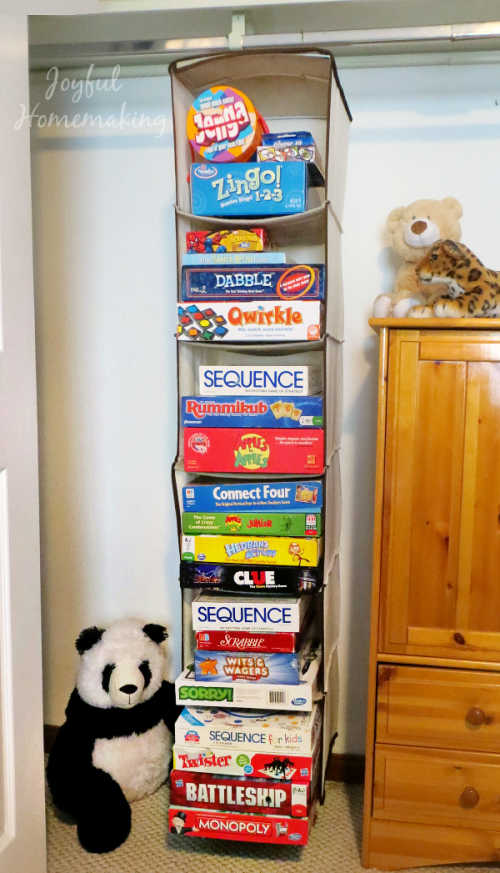 We have 10+ board game storage ideas that will get your games organized. Make game night even more fun when you get your board game collection in order. Hanging organizer with games.