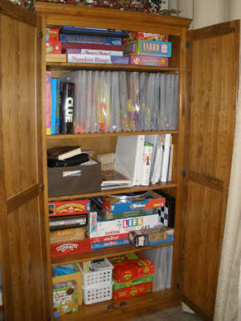 We have 10+ board game storage ideas that will get your games organized. Make game night even more fun when you get your board game collection in order. Bookshelf with scrapbook organizers for games.
