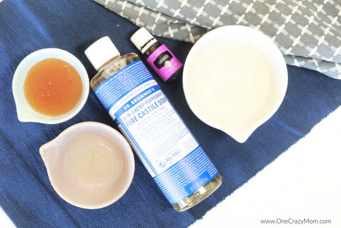 DIY Body Wash is so easy to make and leaves your skin really soft and hydrated. Our entire family loves it including the kids! Ingredients for homemade body wash - coconut oil, raw honey, castile soap, vitamin E oil, lavender essential oil, jar.