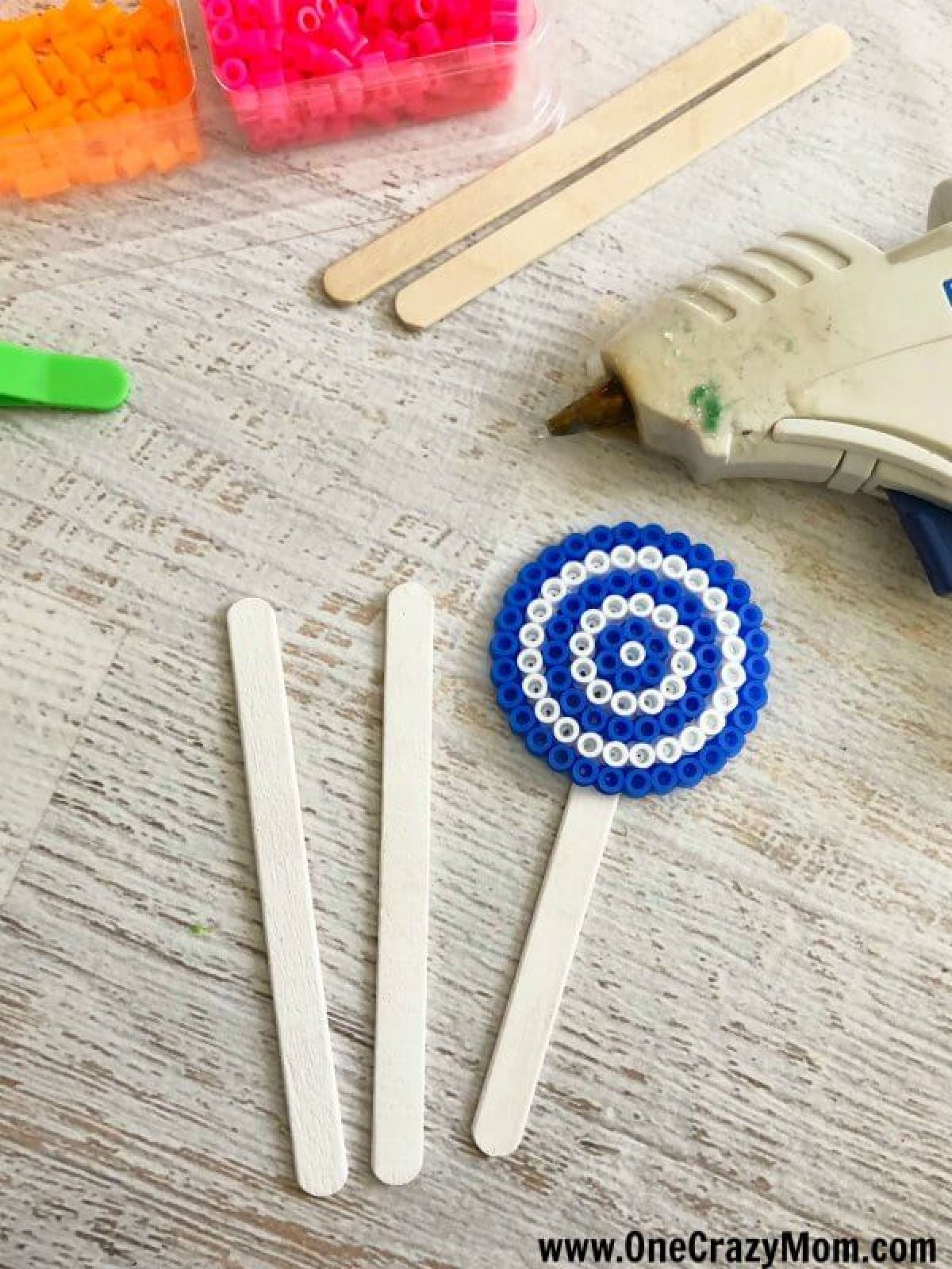 Perler beads are so fun and this Lollipop Perler Beads Craft is the perfect activity for the kids. This craft idea is simple and frugal but a blast to make! Perler beads are so fun and this Lollipop Perler Beads Craft is the perfect activity for the kids. This craft idea is simple and frugal but a blast to make!