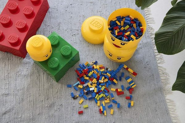 Are Lego's taking over your house? Try these clever 15+ Lego storage ideas to get everything in order and make Lego time even more fun. Lego head with legos.