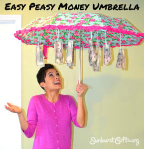 We have over 15 cute ideas for giving money. Some people are hard to shop for and you need creative Money Gift Ideas to make giving cash special. Umbrella with cash hanging down.