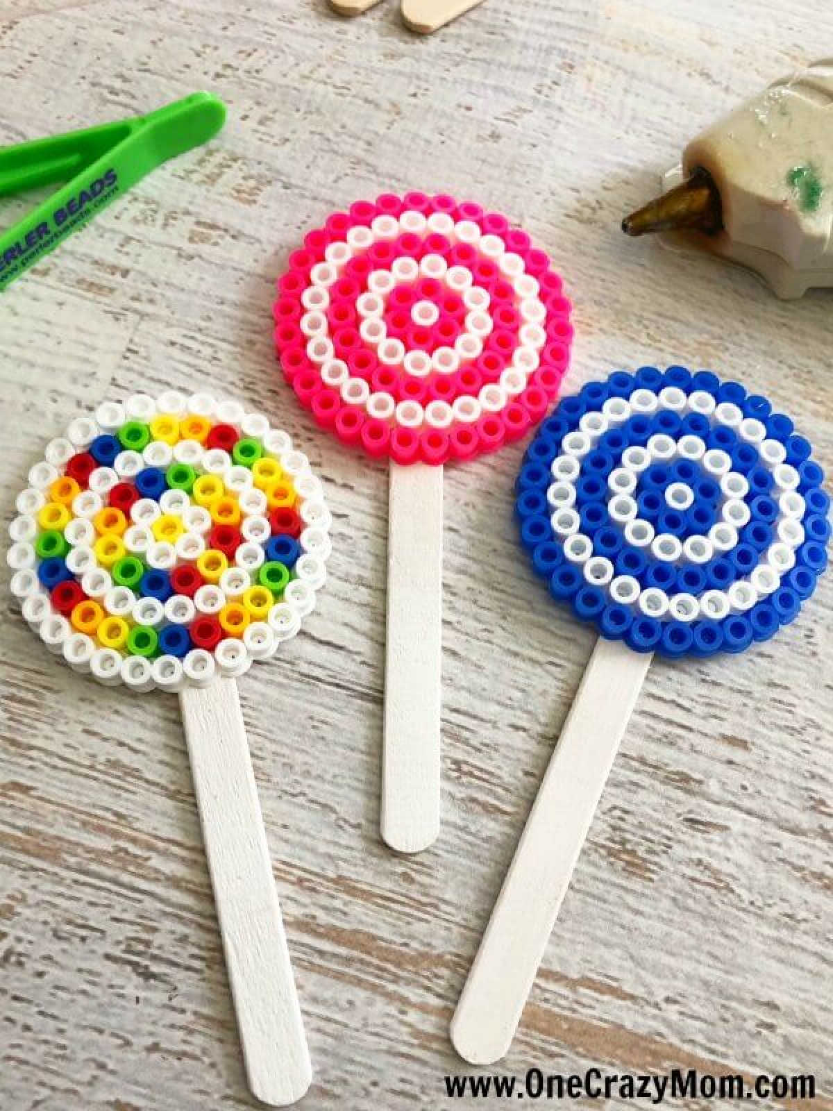Perler beads are so fun and this Lollipop Perler Beads Craft is the perfect activity for the kids. This craft idea is simple and frugal but a blast to make! Perler beads are so fun and this Lollipop Perler Beads Craft is the perfect activity for the kids. This craft idea is simple and frugal but a blast to make!