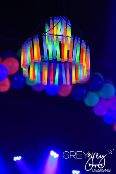 Find over 20 Glow in the dark party ideas that are easy and budget friendly. Your next party will be fabulous with these glow in the dark party decorations. Glow in the dark chandelier hanging.