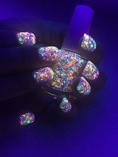 Find over 20 Glow in the dark party ideas that are easy and budget friendly. Your next party will be fabulous with these glow in the dark party decorations. Glow in the dark nail polish in a hand.