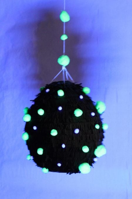 Find over 20 Glow in the dark party ideas that are easy and budget friendly. Your next party will be fabulous with these glow in the dark party decorations. Glow in the dark pinata hanging.