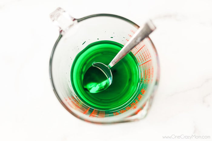 If your kids like to make slime, they will enjoy learning how to make oobleck. You only need 2 ingredients and this DIY doubles as a science experiment. Measuring cup with liquid and spoon.