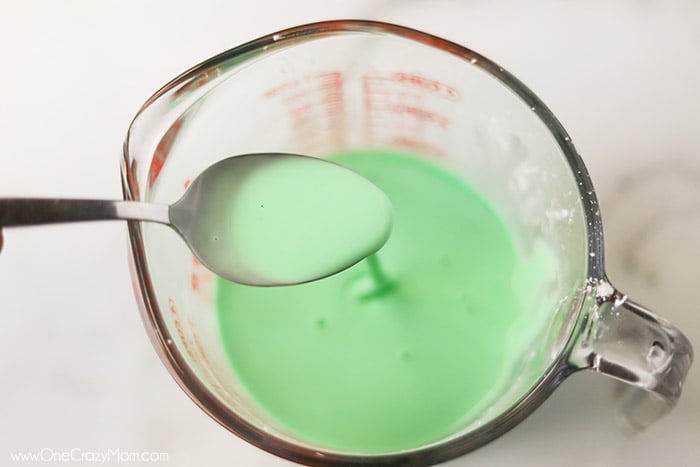 If your kids like to make slime, they will enjoy learning how to make oobleck. You only need 2 ingredients and this DIY doubles as a science experiment. Measuring cup with ingredients mixed with spoon.