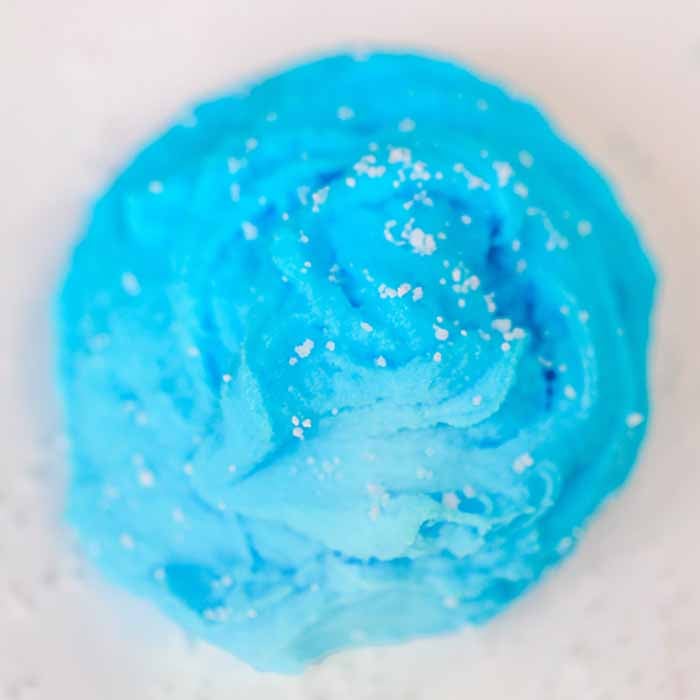 We have the best cloud slime recipe and it is super easy to make. If your kids love slime, they are going to love to learn how to make cloud slime. Blue cloud slime in a ball.