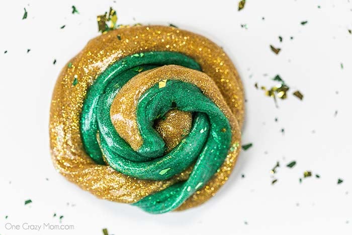 Everyone loves to make slime and your kids will go crazy over this St Patrick's Day Slime. It is so glittery and fun to make and play with. St Patrick's Day Slime swirled together.