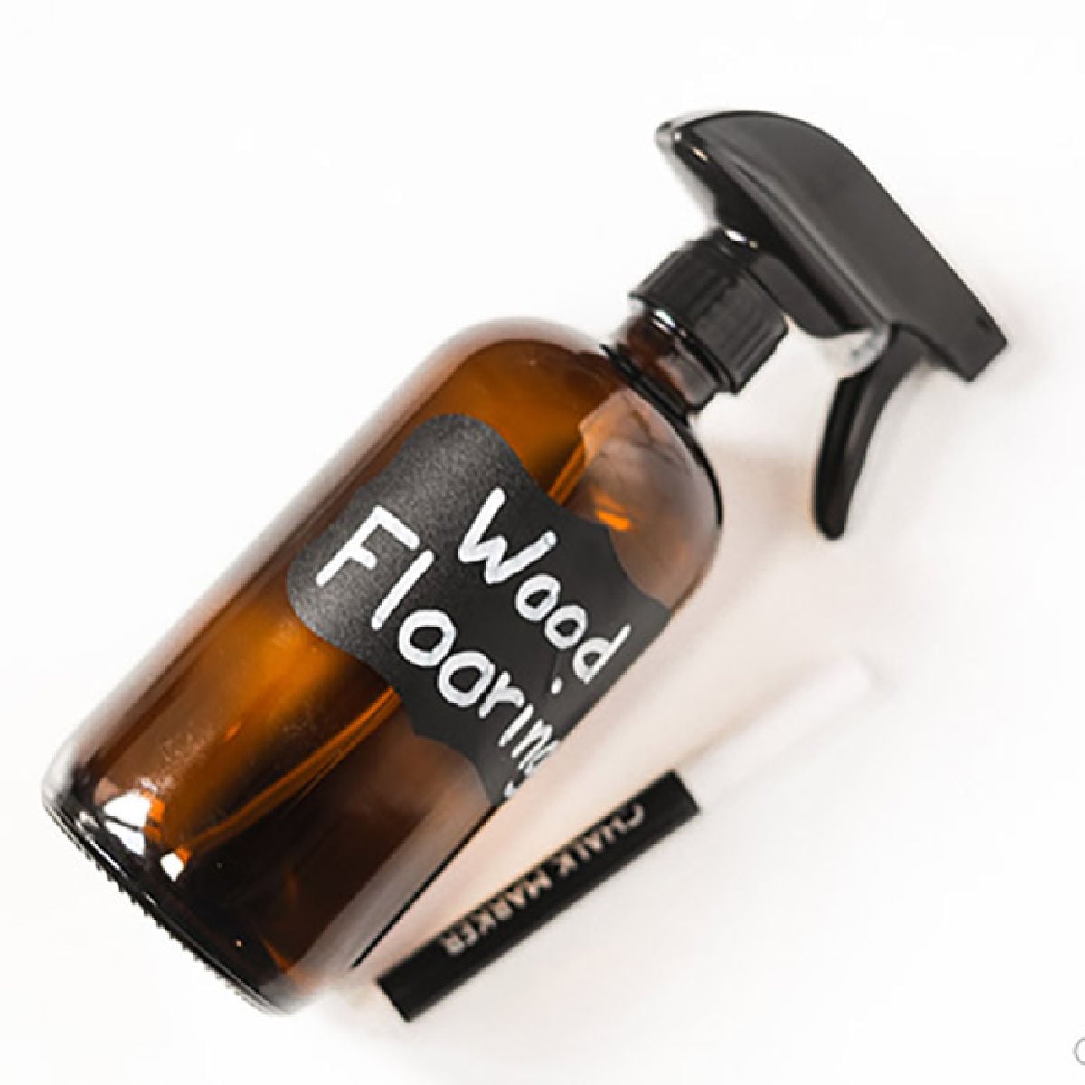 Make this DIY hardwood floor cleaner in just minutes for an all natural cleaner you will love. From floors to trim and more, your wood will be so clean. Glass Spray Bottle labeled with wood flooring and a pen