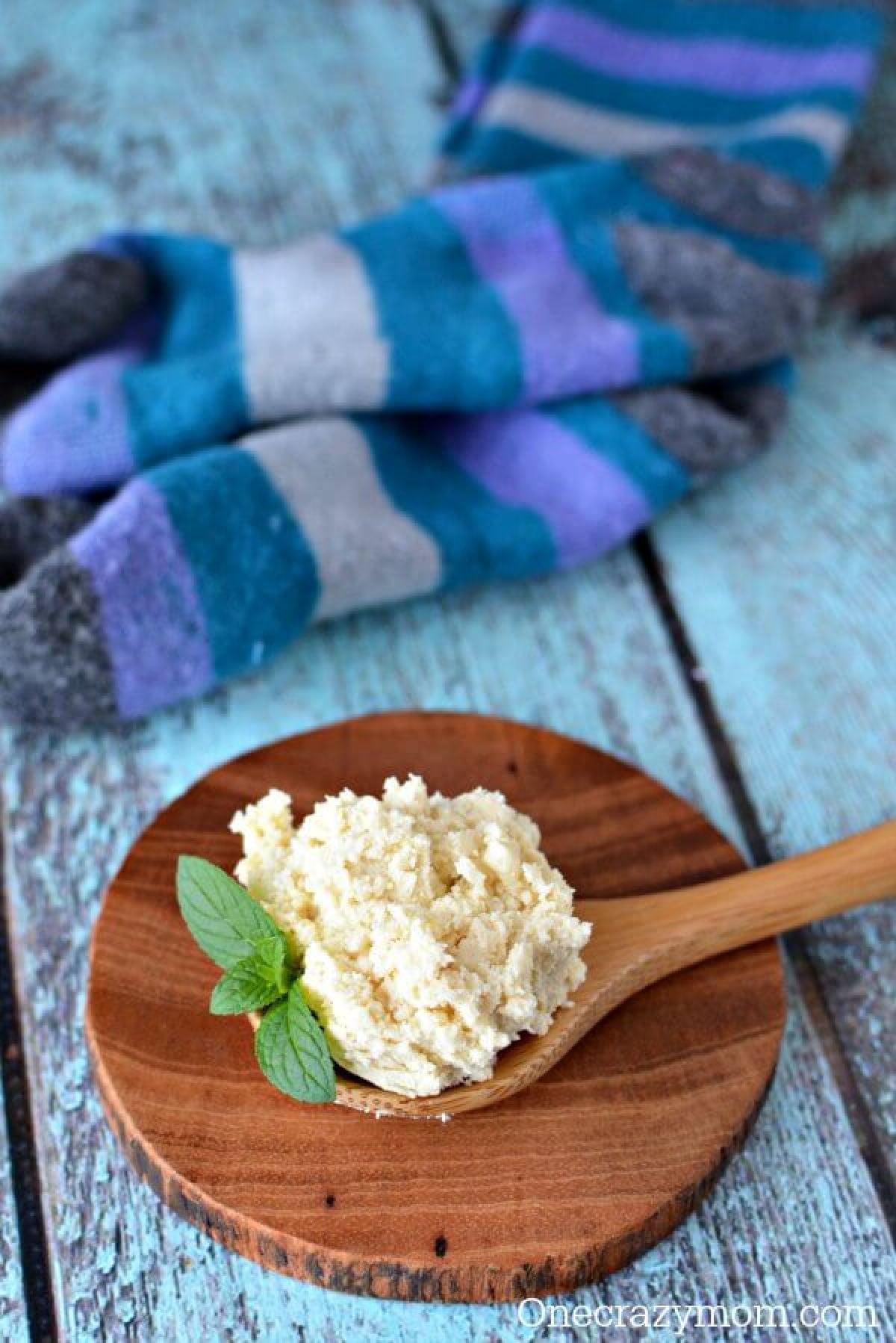 Try this DIY foot scrub! Peppermint foot scrub is perfect for tired feet. You will love this homemade foot scrub. So easy! Foot scrub on a wooden spoon ready to use.