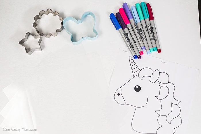 Learn how to make shrinky dinks today for a fun activity the kiddos will love. Get creative and make lots of fun designs with these homemade shrinky dinks. Supplies for Shrink Dinks- Shrinky Dink plastic and cookie cutters with sharpies.