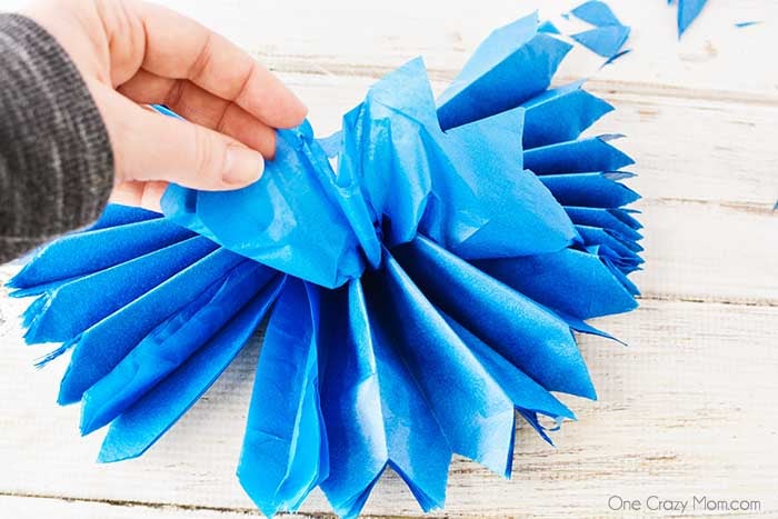Tissue paper pom poms are so pretty for birthday parties, baby showers and more. Learn how to make these easily with dollar store supplies. Tissue paper pom poms are so pretty for birthday parties, baby showers and more. Learn how to make these easily with dollar store supplies.