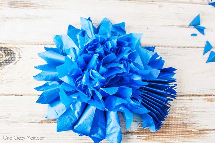 Tissue paper pom poms are so pretty for birthday parties, baby showers and more. Learn how to make these easily with dollar store supplies. Tissue paper pom poms are so pretty for birthday parties, baby showers and more. Learn how to make these easily with dollar store supplies.