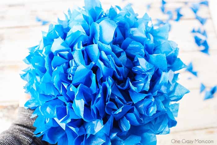 Tissue paper pom poms are so pretty for birthday parties, baby showers and more. Learn how to make these easily with dollar store supplies. Tissue paper pom poms are so pretty for birthday parties, baby showers and more. Learn how to make these easily with dollar store supplies.