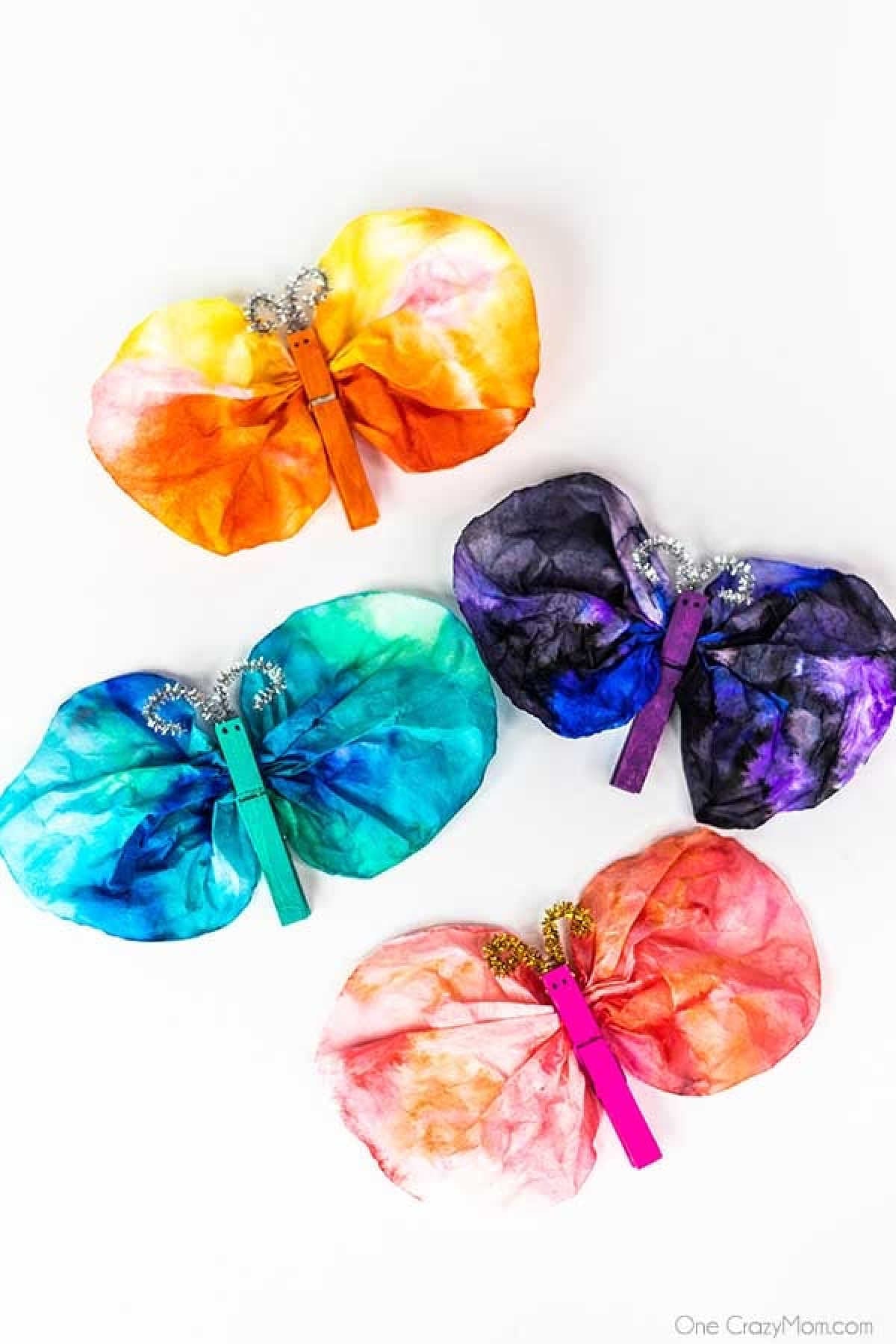 With just a few simple dollar store supplies, you can make a whimsical Clothespin Butterfly. It is the perfect craft to do with the kids and so easy. Butterflies in different colors.