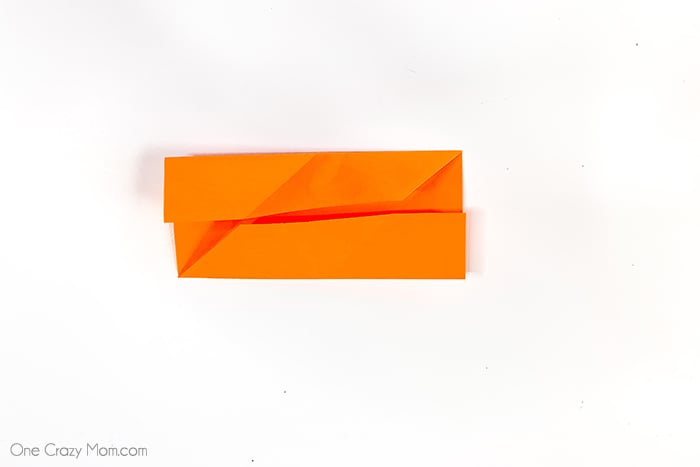 Grab some paper and learn how to make this easy origami cube. This is a simple but fun activity perfect to keep the kids busy while having a blast. Step by step instructions for making an origami cube.
