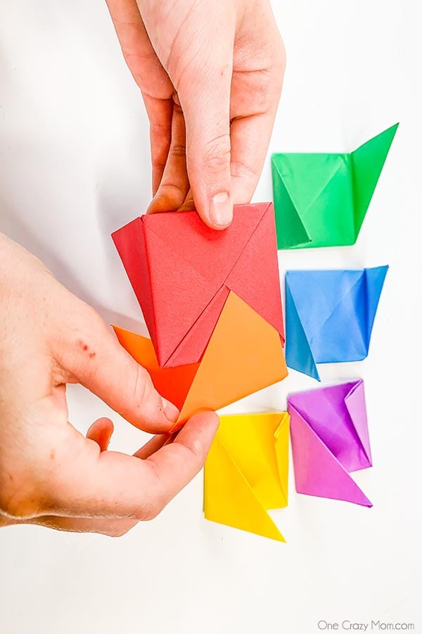 Grab some paper and learn how to make this easy origami cube. This is a simple but fun activity perfect to keep the kids busy while having a blast. Step by step instructions for making an origami cube.