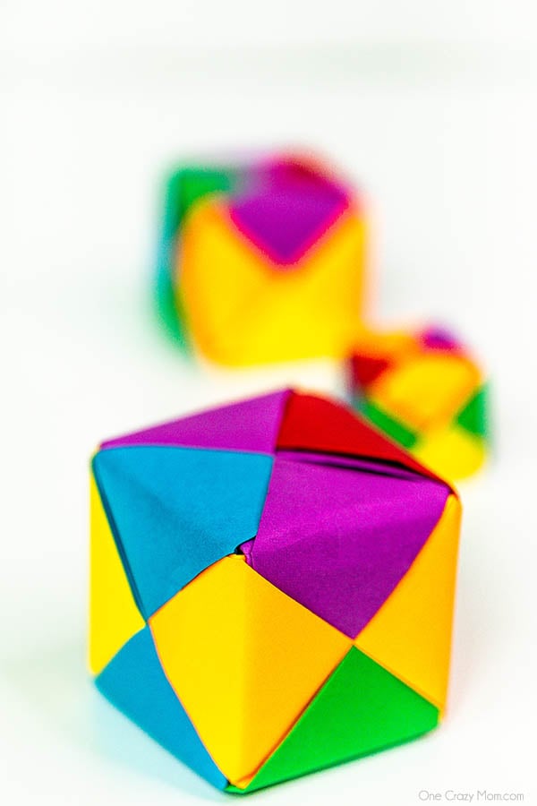 Grab some paper and learn how to make this easy origami cube. This is a simple but fun activity perfect to keep the kids busy while having a blast. Step by step instructions for making an origami cube.