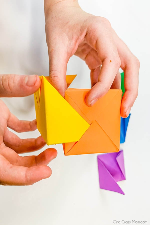 Grab some paper and learn how to make this easy origami cube. This is a simple but fun activity perfect to keep the kids busy while having a blast. Step by step instructions for making an origami cube.
