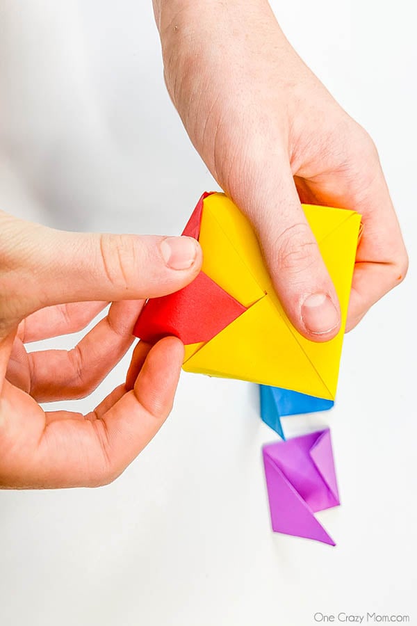 Grab some paper and learn how to make this easy origami cube. This is a simple but fun activity perfect to keep the kids busy while having a blast. Step by step instructions for making an origami cube.