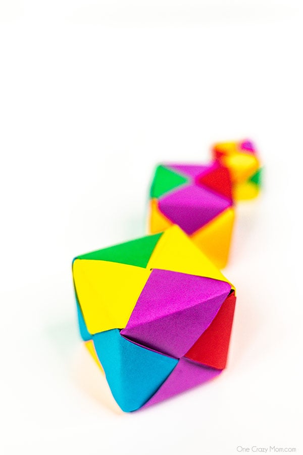 Grab some paper and learn how to make this easy origami cube. This is a simple but fun activity perfect to keep the kids busy while having a blast. Step by step instructions for making an origami cube.