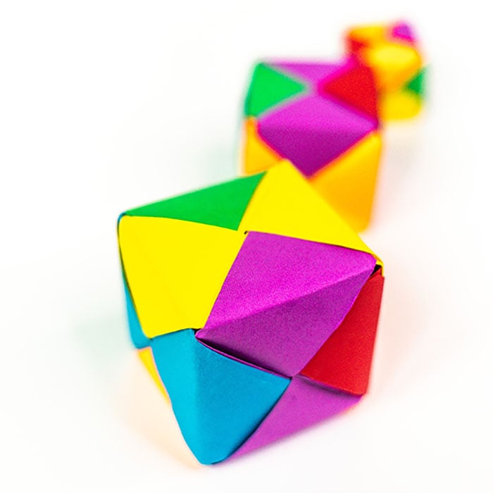 Grab some paper and learn how to make this easy origami cube. This is a simple but fun activity perfect to keep the kids busy while having a blast. Origami cube close up.