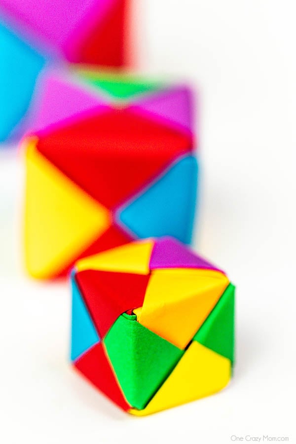 Grab some paper and learn how to make this easy origami cube. This is a simple but fun activity perfect to keep the kids busy while having a blast. Step by step instructions for making an origami cube.