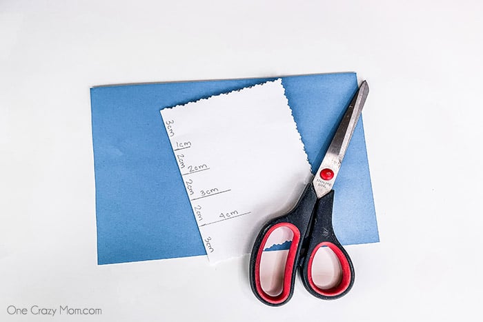 Paper folded and marked with lines. 