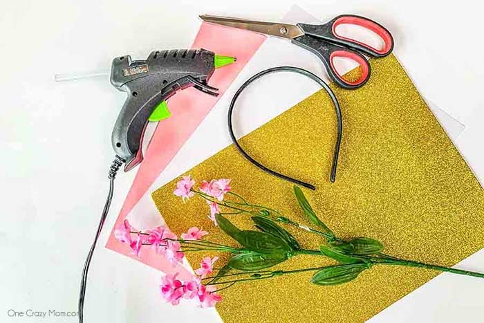 Save money and make this DIY Unicorn Headband with supplies from the dollar store! It is so easy to learn how to make a unicorn headband. Supplies for Unicorn Headband - headband, foam, construction paper, flowers.