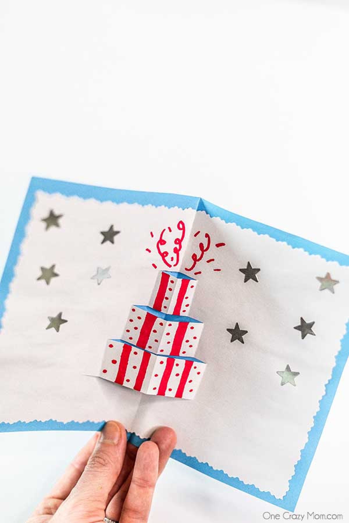 Pop Up Card unfolded with a cake. 