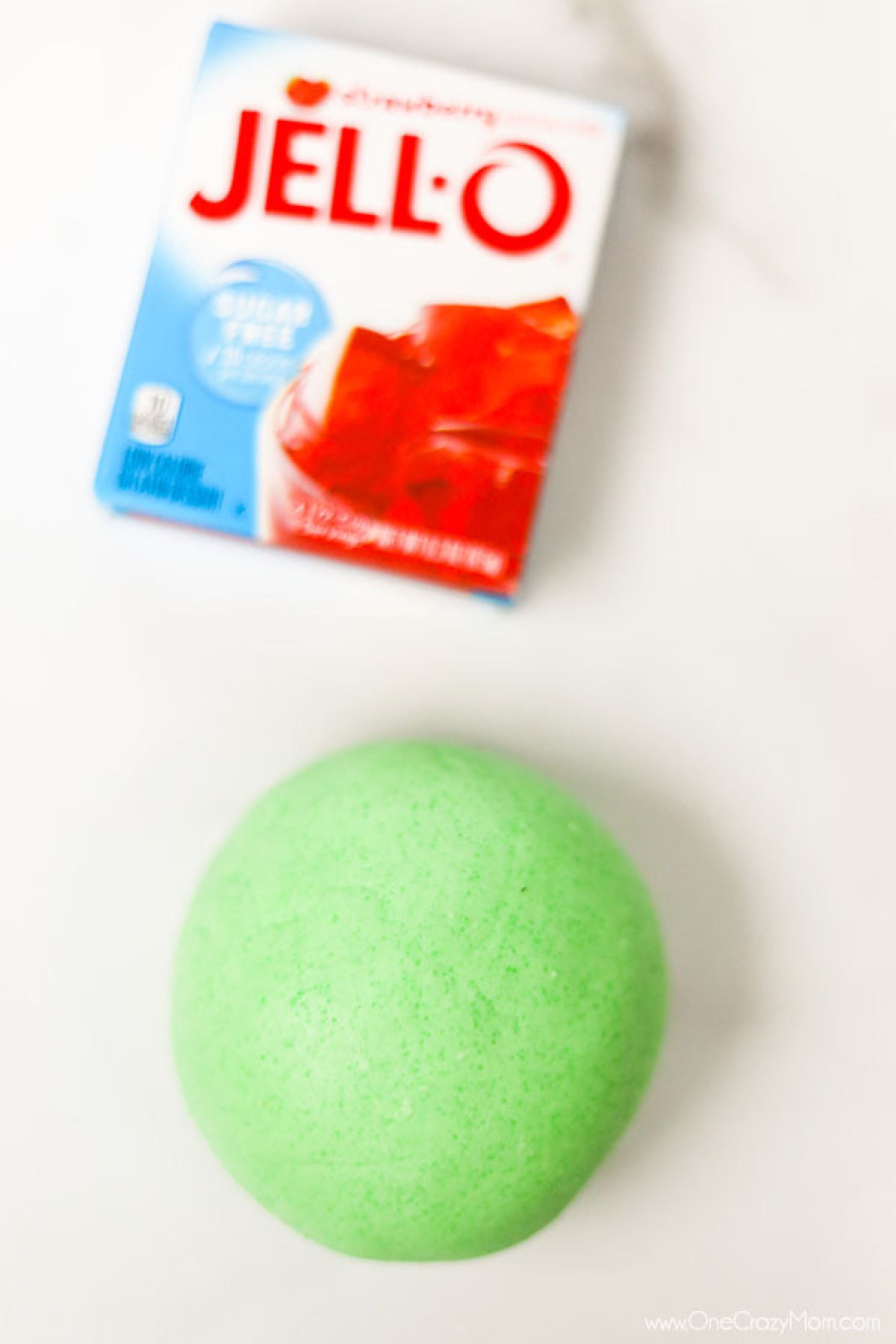Jello Slime is so cool to make and you only need 3 ingredients. Make edible jello slime today for a super fun activity with the kids that is really simple. Jello Slime in a ball.