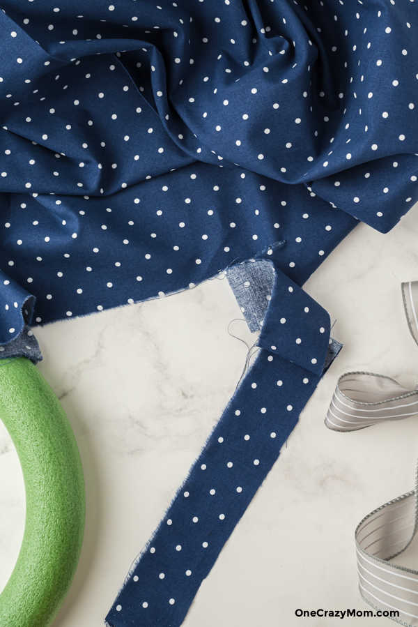 Cutting strips of fabric.