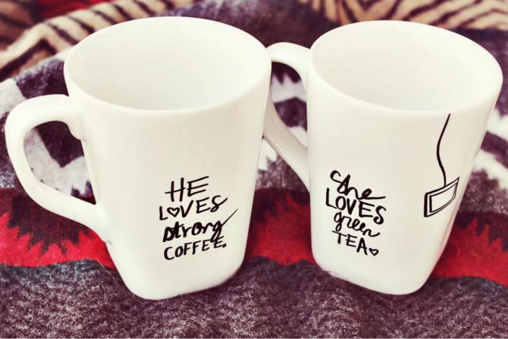 His and her mugs on a blanket.