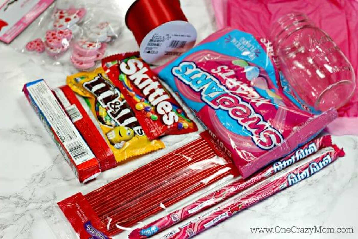 This Candy Bouquet DIY is a fun Valentine's Day gift idea! Learn how to make this Easy Candy Bouquet quickly. Make this fun Candy Arrangement today.