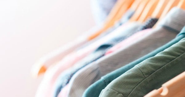 Clothes hanging in closet.