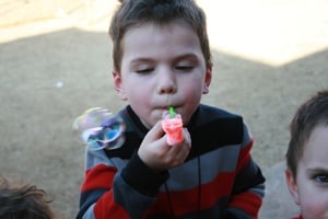 IMG_0655 Child blowing bubbles.