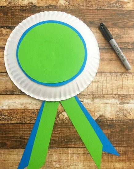 Circles and ribbon glued on award ready to personalize.