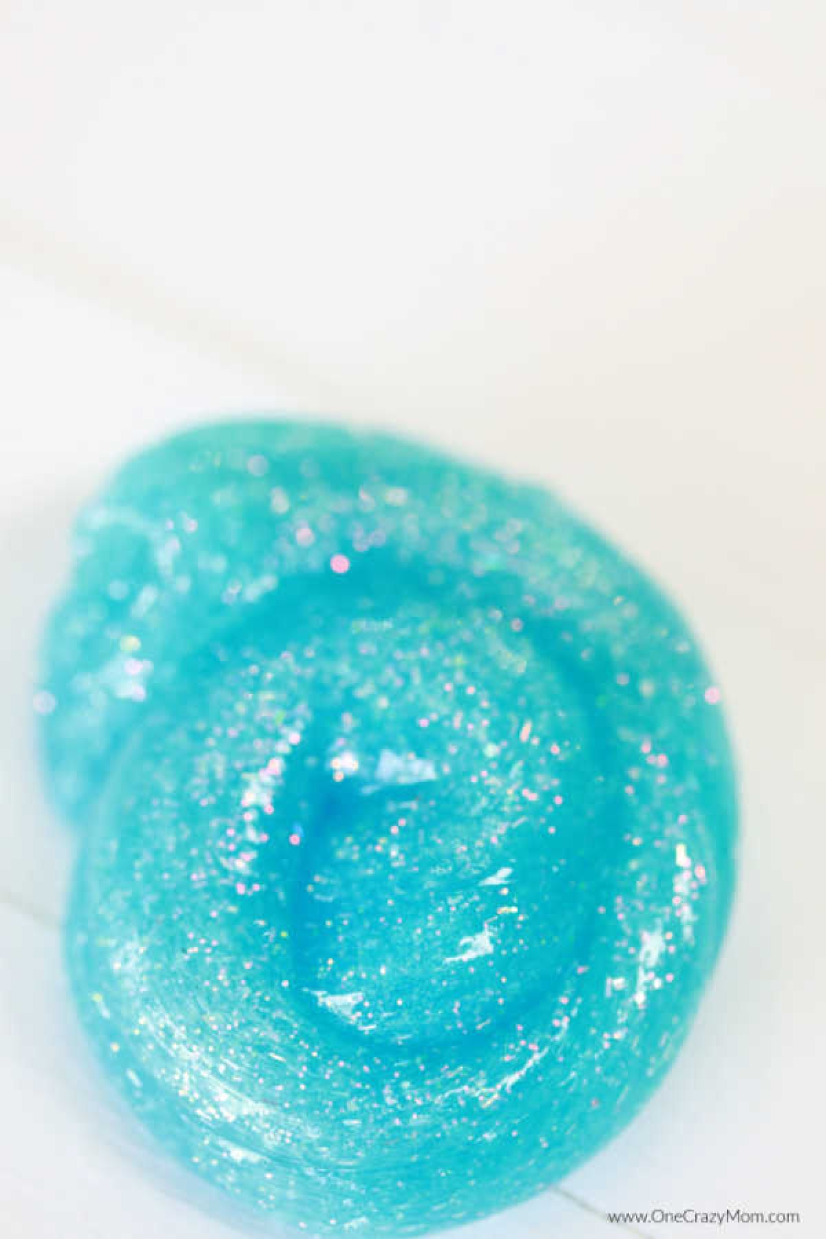 We have a super simple DIY for 2 Ingredient Slime that your kids can make. You can make really cool slime with ONLY 2 ingredients that your kids will love! Slime in a pile.