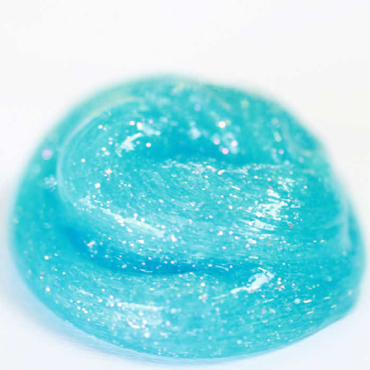 We have a super simple DIY for 2 Ingredient Slime that your kids can make. You can make really cool slime with ONLY 2 ingredients that your kids will love! Slime in a pile.