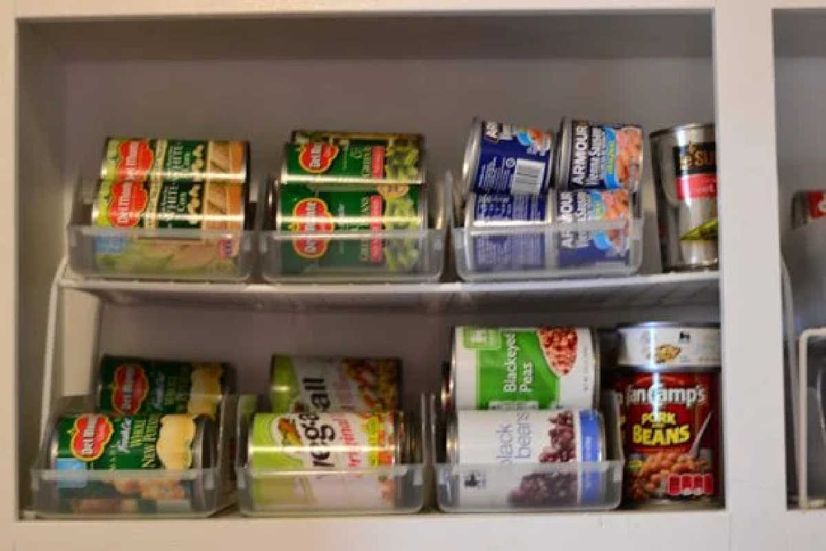 Learn how to organize canned food with these easy canned food storage ideas. Over 15 canned food storage hacks that will get your pantry in order.
