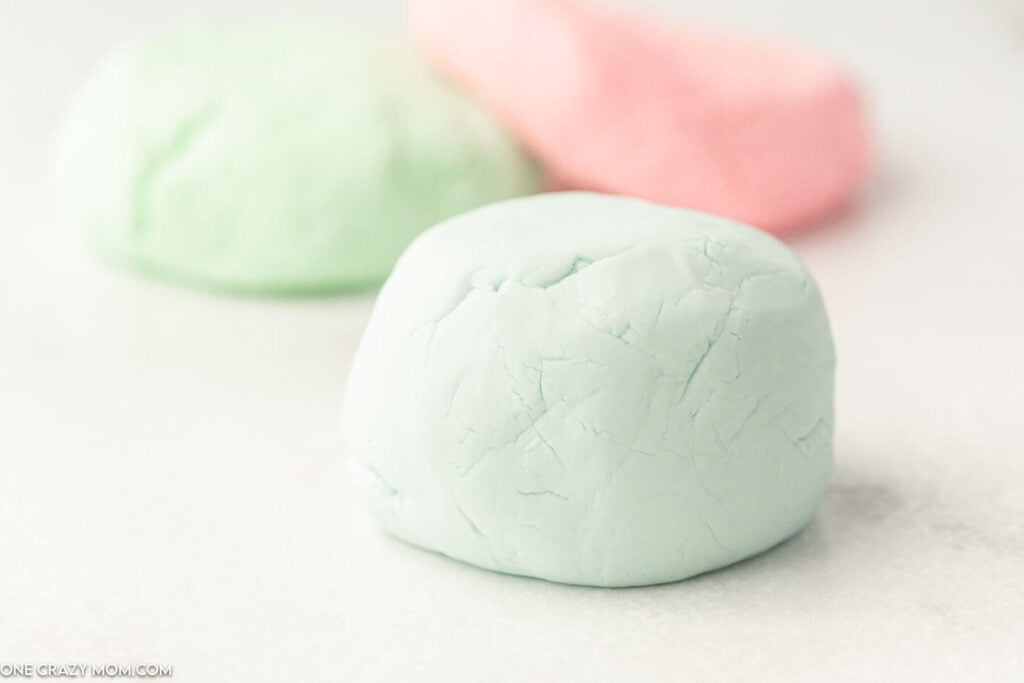 Cloud dough shaped into balls. 