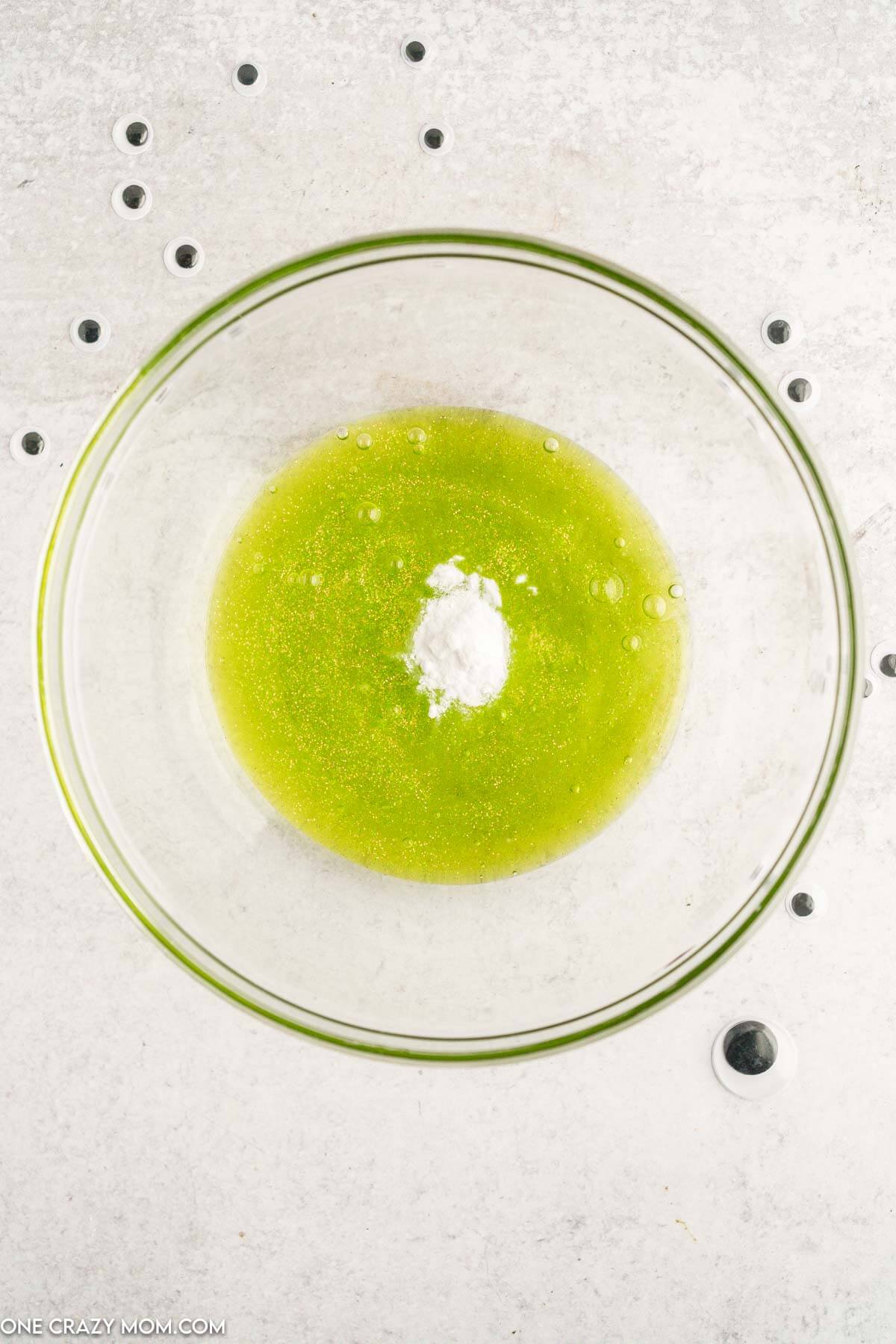 Glitter glue in mixing bowl with baking soda.
