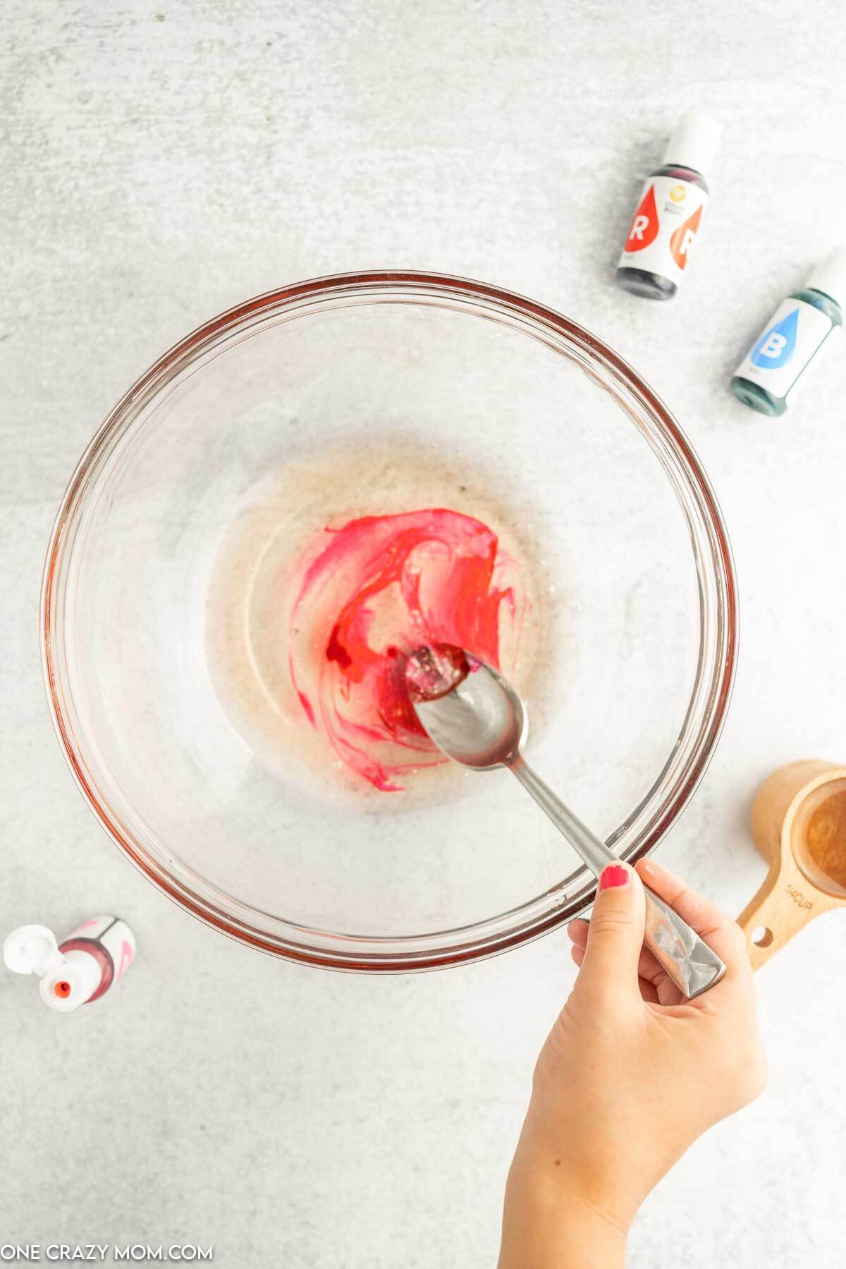 Bowl with food coloring and shampoo.