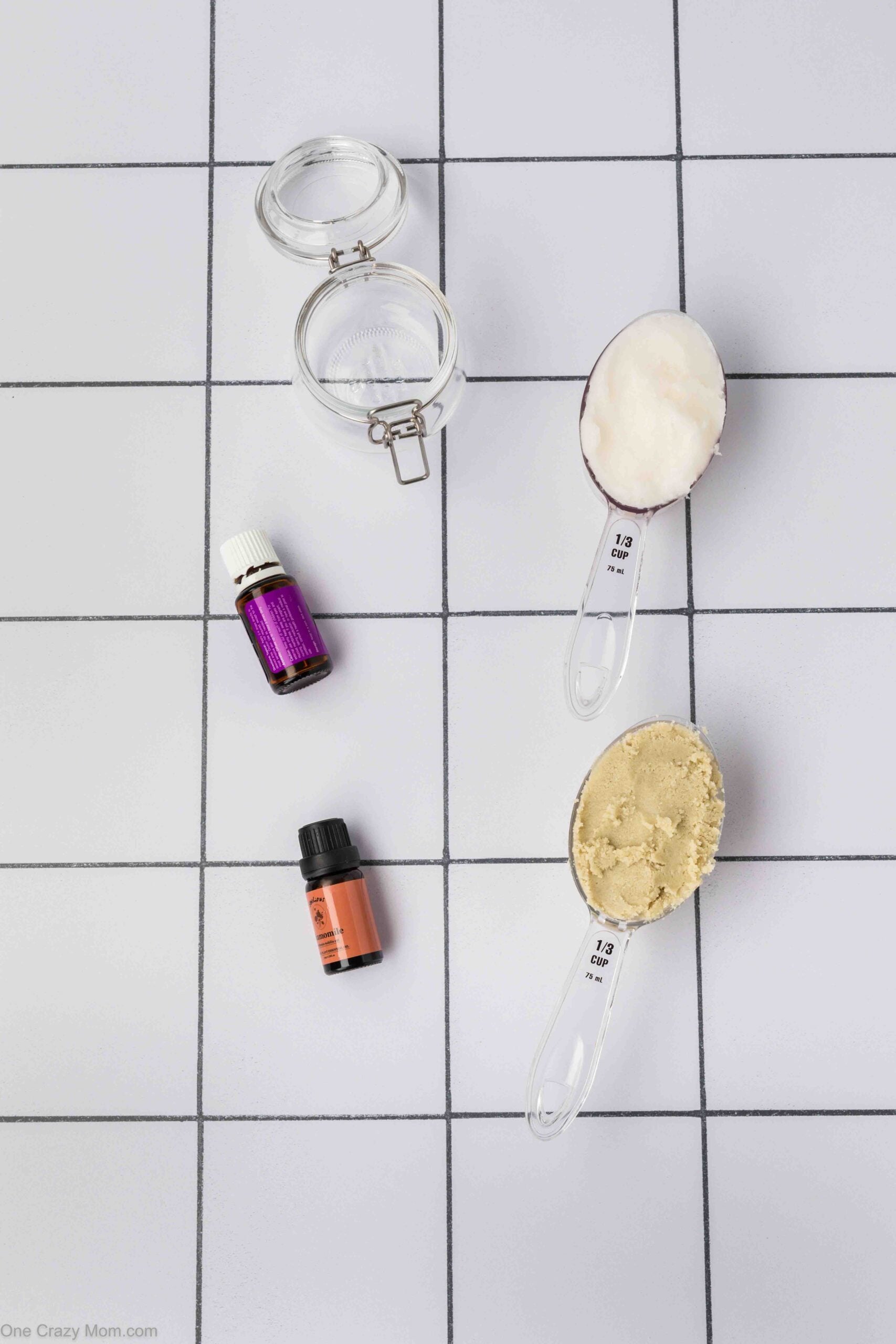 Ingredients for lotion - coconut oil, shea butter, lavender oil, mason jar.