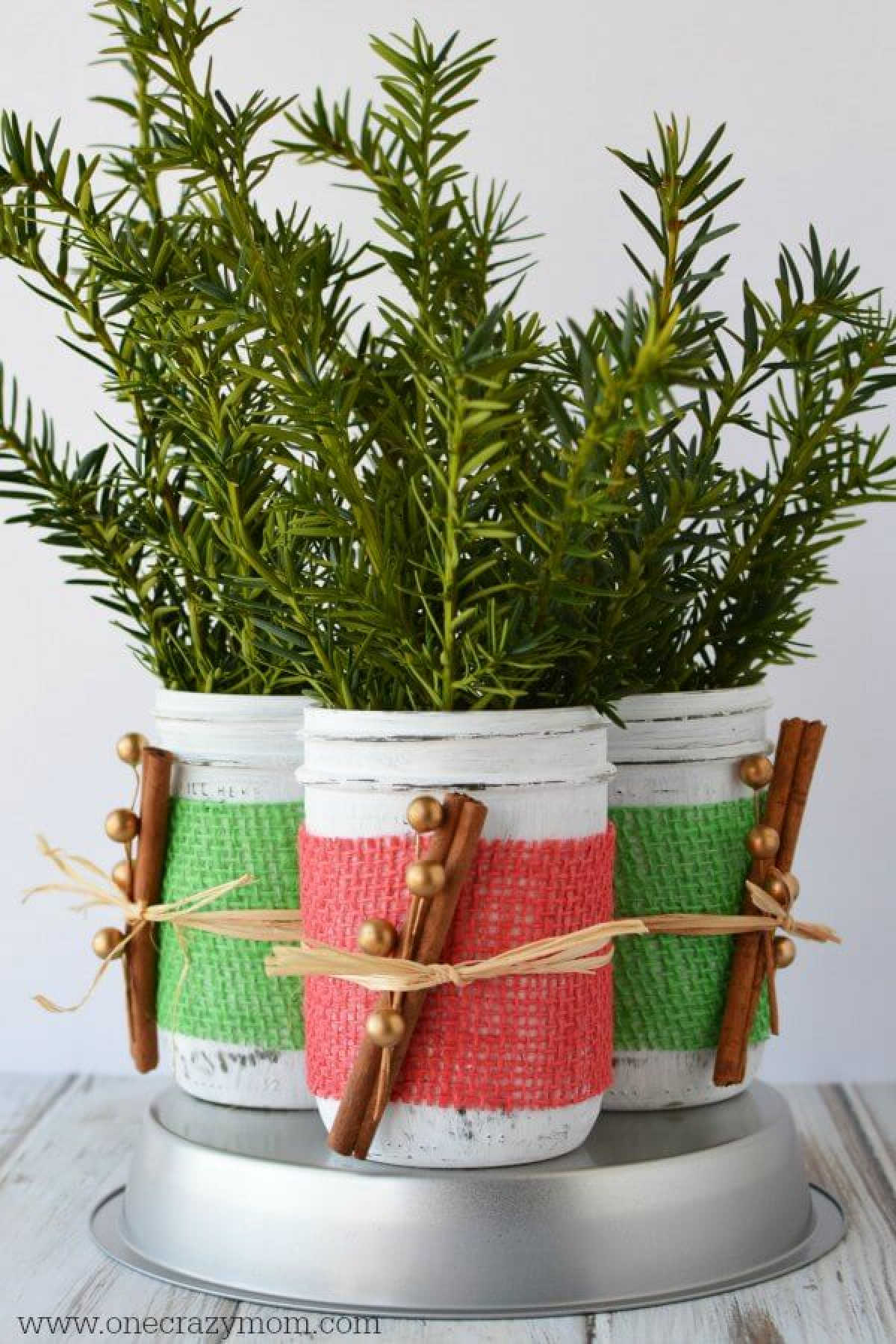 If you're looking for holiday centerpiece ideas,make this rustic Christmas centerpiece.This mason jar Christmas centerpiece is so simple and easy!