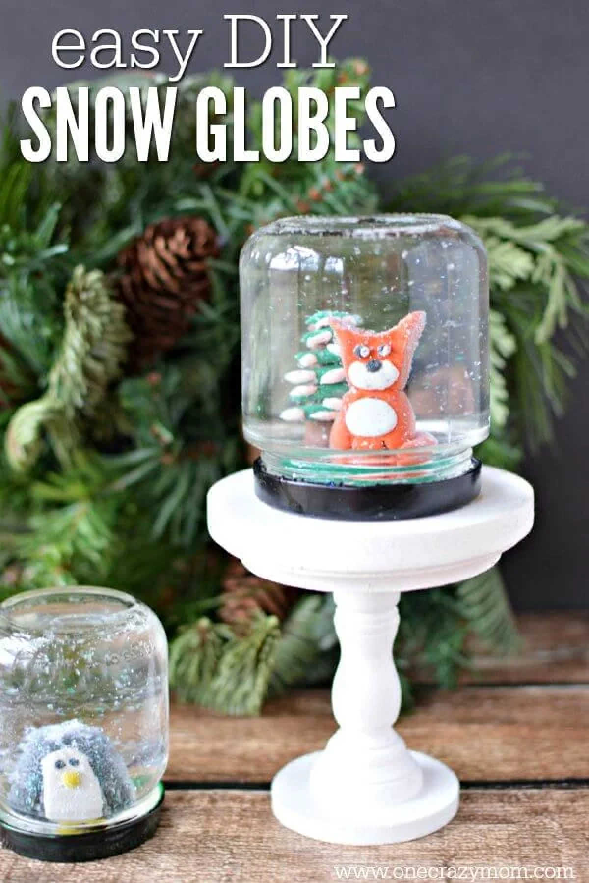 Learn how to make a snow globe craft! This DIY snow globe is so easy and fun to make.Homemade snow globes are so special. Make your own snow globe today! Snow globe on a stand.